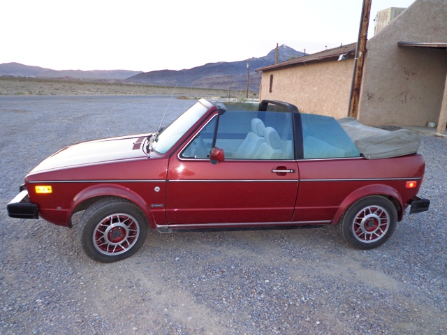 Red VW Cabriolet with the top down